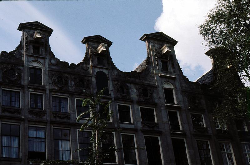 Amsterdan_furniture_hoists Canal frontage was precious. so the buildings and their doorways and staircases are narrow.  They used block and tackle to lift furniture from the canal or street and bring it in through wide windows.