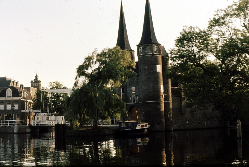 Eastern_Gate These slides were taken when Ruth and I visited Delft in 1974.  The Eastern Gate (Oostpoort) in Delft was built around 1400. Around 1510 the towers were enhanced with an additional octagonal floor and high spires. This is the only city gate remaining in Delft, the others were demolished in the nineteenth century. [Wikipedia]