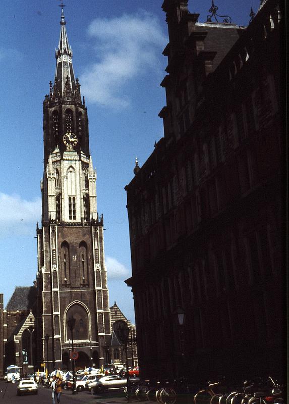 Niew_Kerk The Niewe Kerk (New Church), Delft.  [Wikipedia]: A vision
In January 1351 a beggar, an eccentric by repute, fell to his knees on the market square in Delft. His name was Brother Simon. According to the ‘Beschrijvinge der Stadt Delft’ (Description of the Town of Delft) dating from 1667, a certain Jan Col brought him some food. He was addressed by Simon with the words: “My dearly beloved friend, dost thou not see the Heavens open?” Both looked towards the sky and, according to tradition, saw a golden church, dedicated to the Virgin Mary.

The beggar died soon after, but for the next thirty years on the same day of January, Jan Col continued to see a brilliant light shining on the spot indicated by Brother Simon. He was convinced that a church should be built in that place. When two deeply devout Beguines supported his request and one of them, moreover, bore the stigmata of Christ on the cross, the town council agreed to the construction of a church on that spot. It was not until it was actually built and consecrated that the annual vision of Jan Col disappeared.

Wooden church
The church which rose up on the market square following the visions of Brother Simon and Jan Col was the second parish church in Delft and was called the ‘Nieuwe Kerk’ (New Church). The original church was a temporary wooden building around which the basilica, as we know it today, was built over a period of a century. The wooden church, which remained until 1420, was dedicated to the Virgin Mary. While the brick basilica was still under construction, St. Ursula became the second patron saint of the Nieuwe Kerk. 