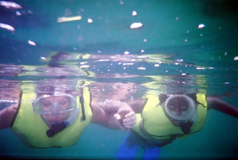 514600-R1-16-14A_017 Ruth teaches Chelsi how to snorkel.