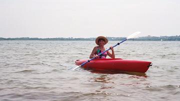 rt-kayak-mnmshw Ruth kayaking on Menemsha Great Pond. We went from north to south on the pond, from Lobsterville down to Stonewall Beach. We also waded and snorkeled the pond and picked up molted horseshoe crab shells. We had a nice picnic on the Lobsterville beach.