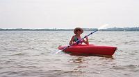 rt-kayak-mnmshw Ruth kayaking on Menemsha Great Pond. We went from north to south on the pond, from Lobsterville down to Stonewall Beach. We also waded and snorkeled the pond and picked up molted horseshoe crab shells. We had a nice picnic on the Lobsterville beach.