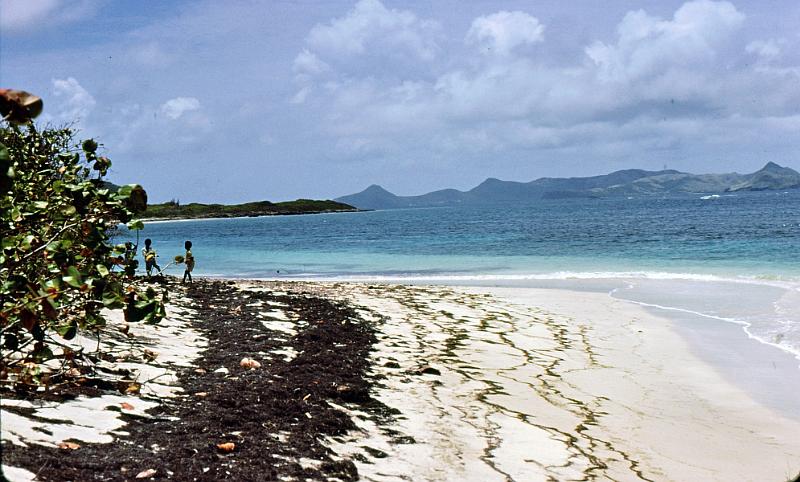 92-beach Beach with St. Kitts 2 miles across the channel.  Crossing it, one must allow for the Gulf Stream current running rapidly through.