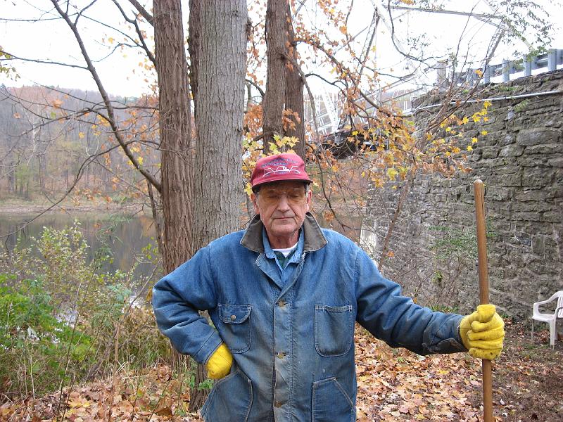 IMG_0699 Blaise Hotlen models a Dingman's Bridge cap.  He's the only one of bridge's present shareholder owners who is also an employee.  Born in a house nearby, he remembered the permanent town residents that we knew. The dam project condemned the town and he salvaged 9 houses to build his own up on the ridge, and he also rebuilt the stone Methodist Church up the Poconos ridge beyond Child's Park.