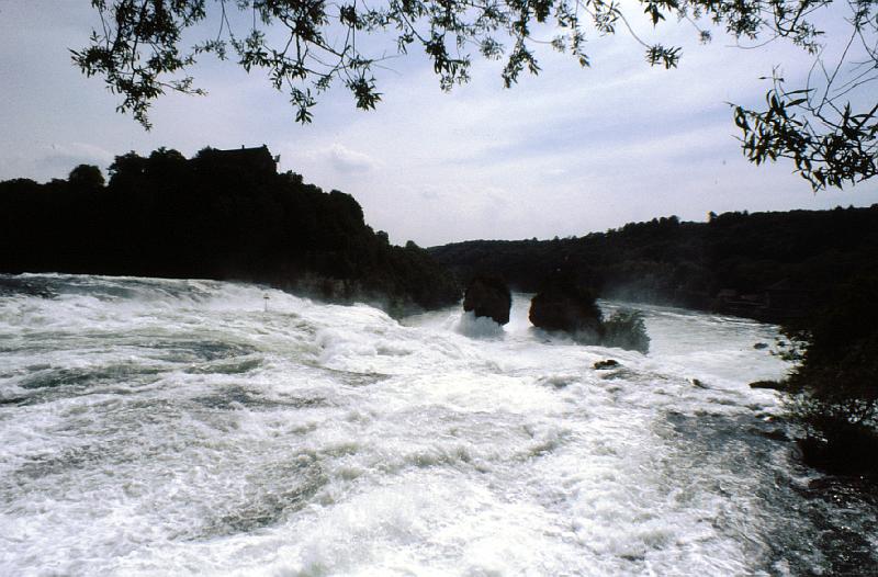 rapids_above_Rheinfall View over the top of the Rheinfall.  There's a resturant over the lip to the right that has a view of the falls.