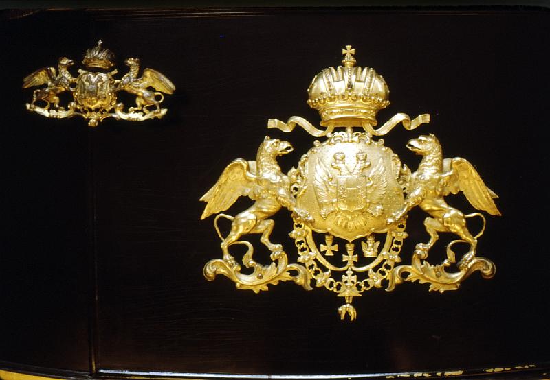 coach_medallion Medallion on an Imperial Carriage.  The Hapsburg double griffon holding gthe double eagle with the symbol of Rome dangling.