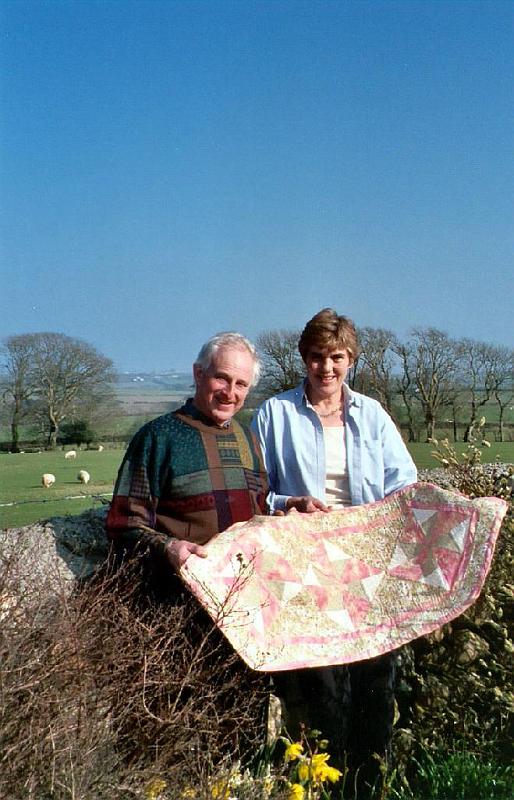 quilt Ruth made this quilted table runner for me to bring as a gift. Tom and Jane are at their garden wall, with their sheep pasture behind.