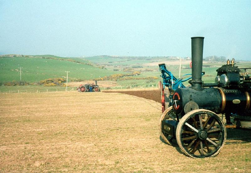 steam_plows In this shot you can see both engines and the plow just being pulled toward the distant one. This was a demonstration at a farm festival that Tom and Jane took me to.