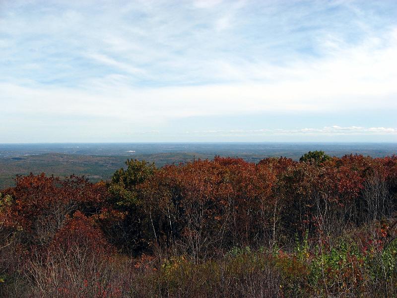 IMG_1034 The mountain is the location of the largest known Old Growth Forest east of the Connecticut River in Massachusetts, with trees dating over 350 years old. This view is to the south. To the east onc can see Boston and to the north, Mt. Monadnock in NH. On a few extraordinary days each decade it is said to be possible to see Mt. Washington in NH to the north.